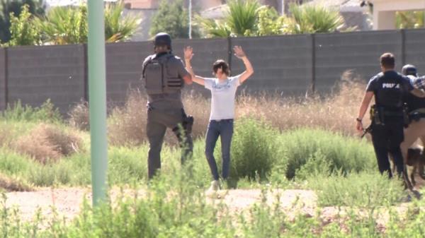 Bailey surrendering to police.
