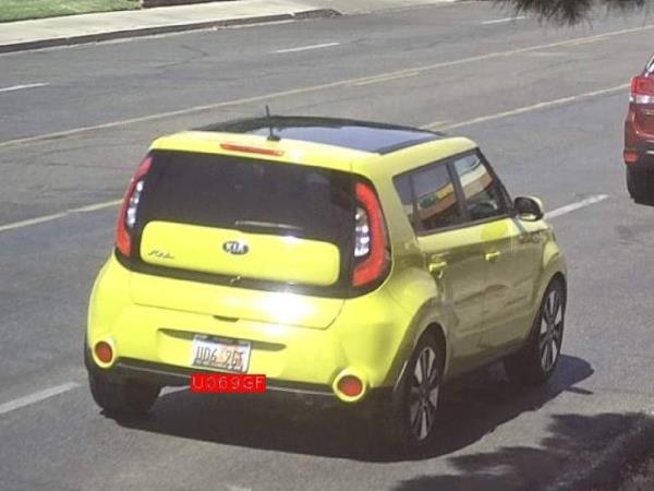 Yellow Kia Soul.
