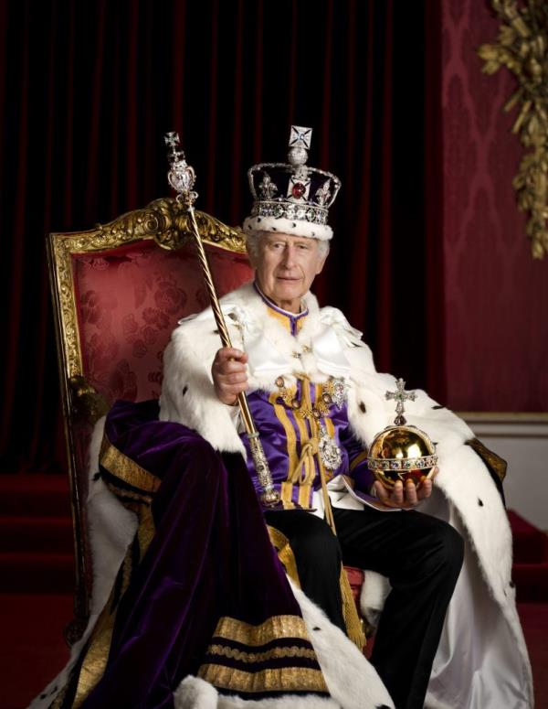 King Charles III is pictured in full regalia in the Throne Room