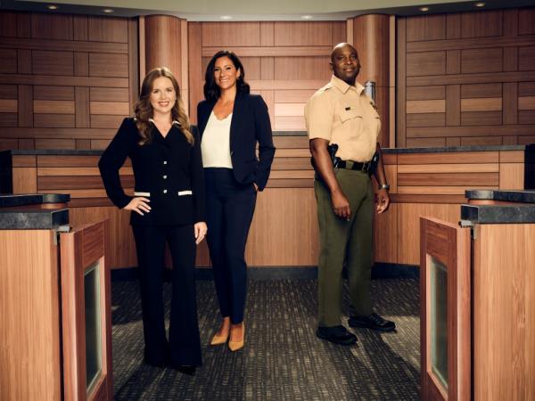 Sarah Rose, court stenographer Whitney Kumar and bailiff Kevin Rasco standing in the middle of the court room. 