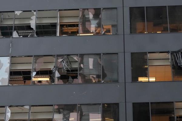 Blown out windows of a downtown high-rise building are shown in the aftermath of a severe thunderstorm Friday, May 17, 2024, in Houston. 