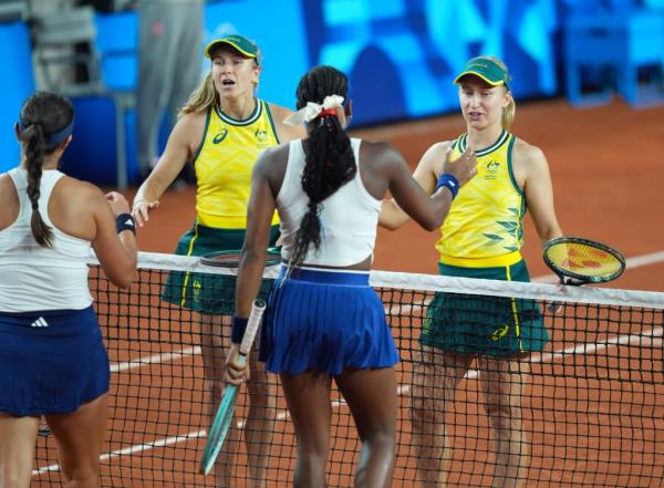 Coco Gauff (USA) and Jessica Pegula (USA) defeat Ellen Perez and Daria Saville (AUS) during a women's tennis doubles match during the Paris 2024 Olympic Summer Games at Stade Roland Garros on July 27, 2024.