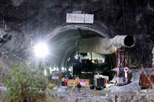 Security perso<em></em>nnel and others are seen near the entrance to the site of an under-co<em></em>nstruction road tunnel that collapsed in mountainous Uttarakhand state, India, on Nov. 16, 2023. 