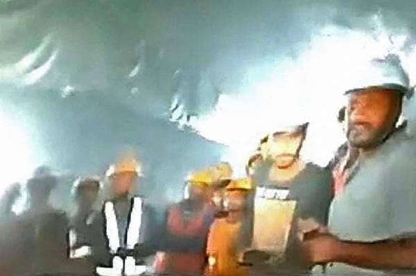A group of workers trapped inside the under-co<em></em>nstruction tunnel, days after it collapsed, are shown on Nov. 21, 2023. 