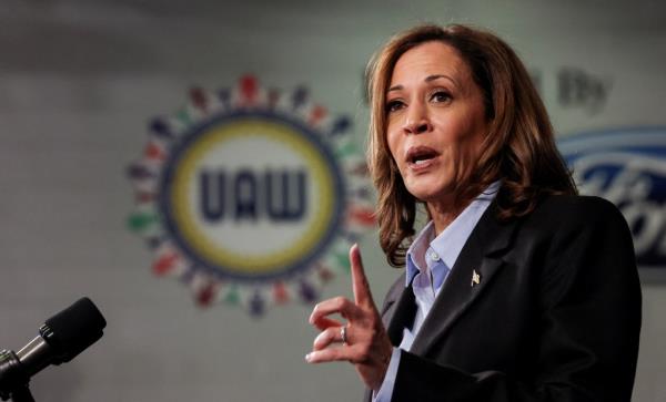 Democratic presidential nominee Kamala Harris speaking at a microphone at North Western High School in Detroit, Michigan, September 2, 2024.