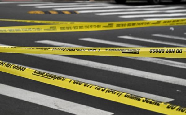 Yellow crime scene tape set up at the corner of Logan Street and Fulton Street wher<em></em>e a shooting occurred and bullet shell casings were found