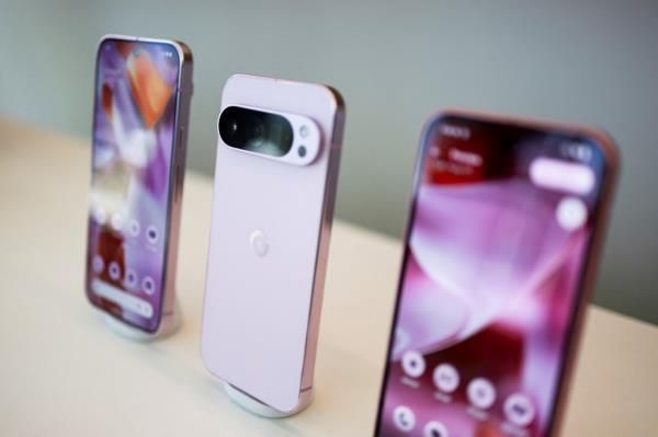 New Google Pixel 9 smartphones, smartwatch, and wireless earbuds displayed on a table at the annual Made by Google event in Mountain View, California
