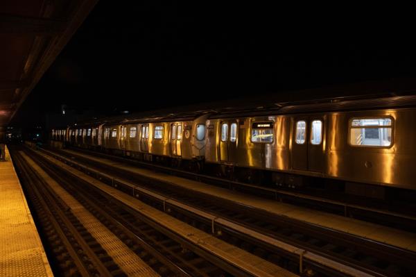 Police investigating a stabbing incident on a train at Broadway and Kosciuszko St. in Brooklyn, with the victim on platform