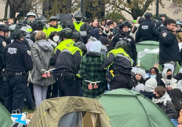 Protesters being handcuffed.