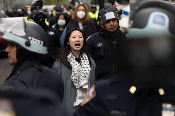 A person is detained by the NYPD at Columbia University.