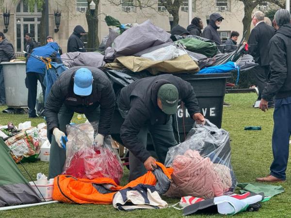 Parts of the encampment are removed by officials.