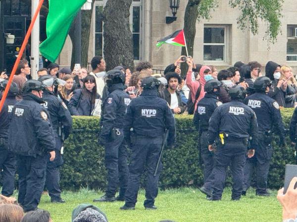 NYPS cops and protesters face off at the scene.