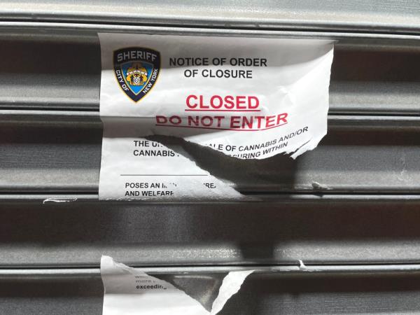 New York City police enforcing a court order to close an illegal smoke shop selling unregulated cannabis