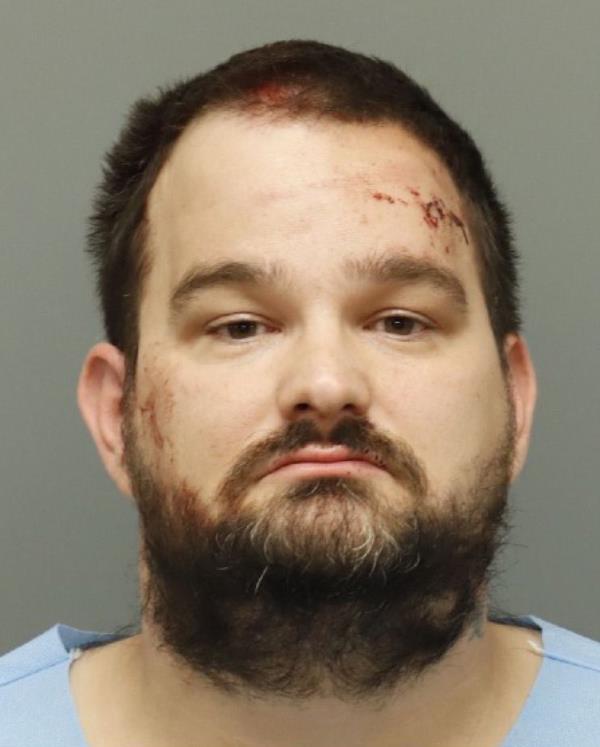 Mirza Zukanovic, 35, is accused of shooting at two people at a Lowes Foods parking lot.