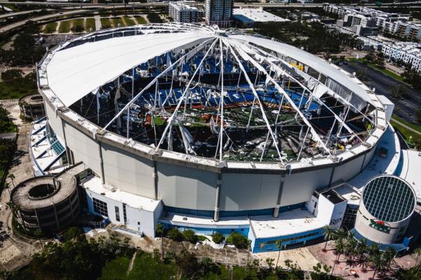 Hurricane Milton making landfall in Tampa, Florida, causing extensive damage to the Kevlar roof of Tropicana Field, home of the Tampa Bay Rays ba<em></em>seball team.