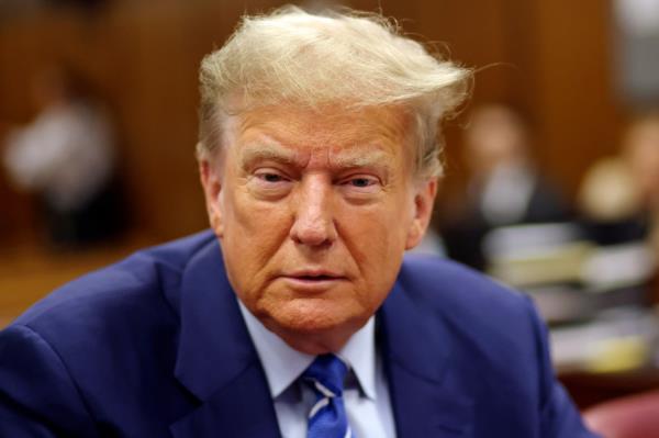 Do<em></em>nald Trump awaits the start of proceedings on the second day of jury selec<em></em>tion at Manhattan criminal court, Tuesday, April 16, 2024, in New York.