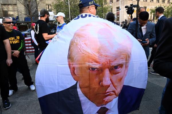 Protesters gather across from New York's criminal courthouse in lower Manhattan on the first day of Do<em></em>nald Trump's hush mo<em></em>ney trial.