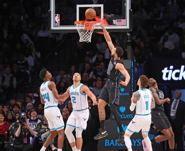 en Simmons #10 of the Brooklyn Nets puts up a shot between Grant Williams #2 of the Charlotte Hornets and LaMelo Ball #1 of the Charlotte Hornets during the second half when the Brooklyn Nets defeated the Charlotte Hornets 116-115 Tuesday, November 19, 2024 