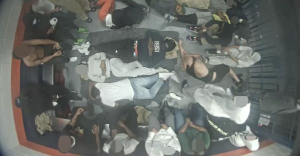 Dozens of men crammed together for days in temporary holding cells amid a pandemic.