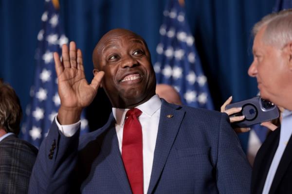 Sen. Tim Scott (R-SC) cheers on Republican presidential candidate and former President Do<em></em>nald Trump speaks during an election night watch party at the State Fairgrounds on February 24, 2024 in Columbia, South Carolina. 
