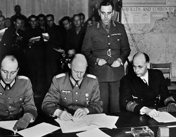 the unco<em></em>nditional German surrender docu<em></em>ment at the Allied headquarters in Reims, eastern France