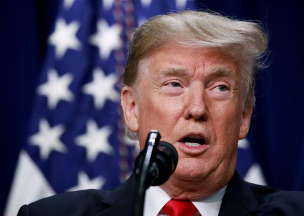Trump speaking at an event.