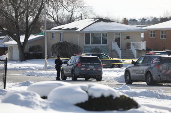 Police work at the scene of a shooting in Tinley Park on Sunday.