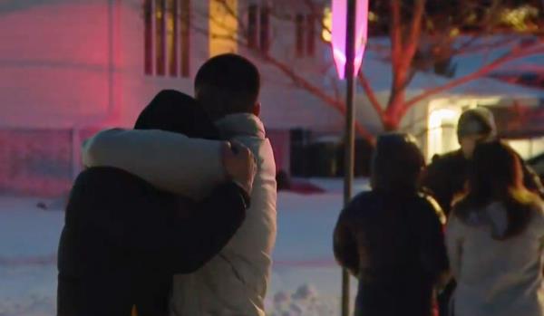 Neighbors of the family stood in shock near the crime scene.