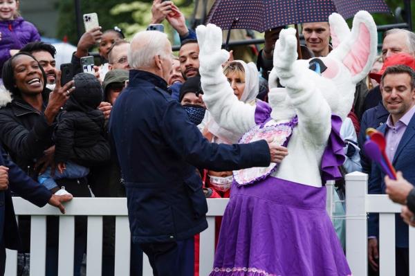 President Joe Biden greeting the Easter Bunny during the 2022 White House Easter EGGucation Roll on the South Lawn