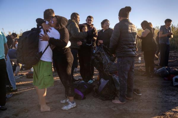 Venezuelan immigrants reunite after crossing the Rio Grande from Mexico on Dec. 18.