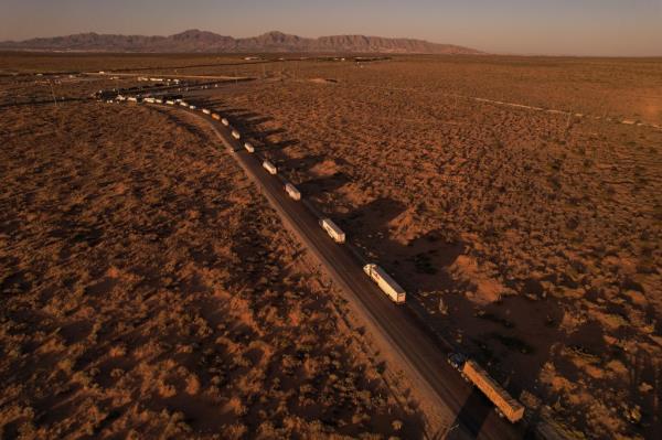 A drone view shows trucks waiting to cross through the border in Santa Teresa, New Mexico.