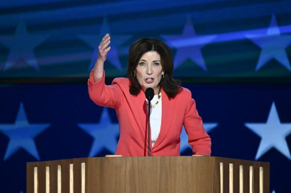 New York Governor Kathy Hochul speaking at the Democratic Natio<em></em>nal Co<em></em>nvention in Chicago, Illinois, at a podium with a microphone