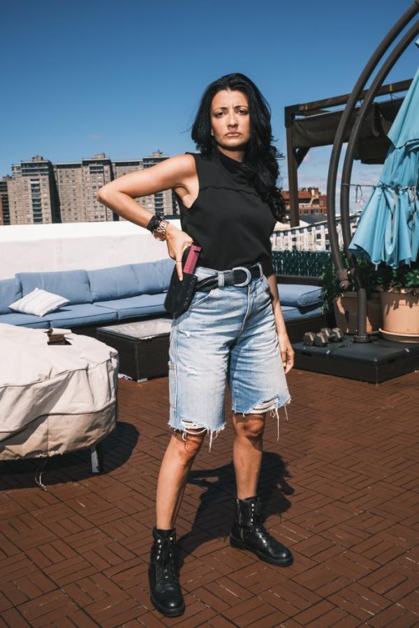 Inna Vernikov poses with a training pistol this past summer