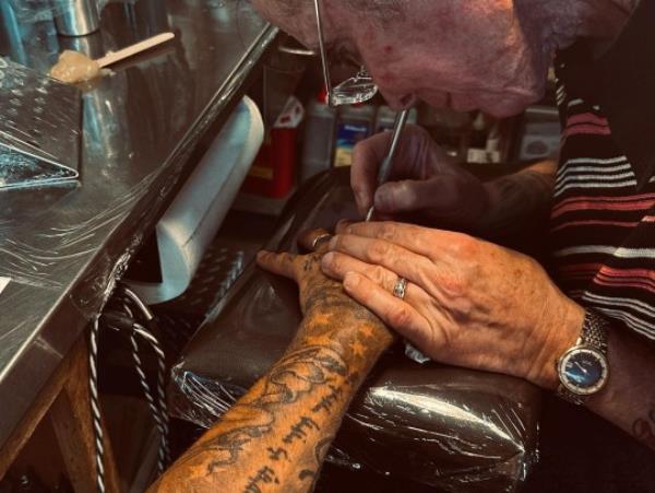 David Beckham getting a tattoo