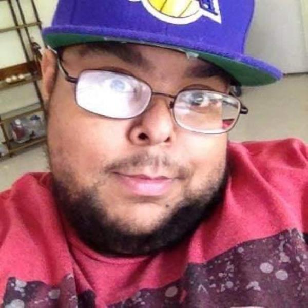 Caleb Willingham in selfie with hat and red shirt