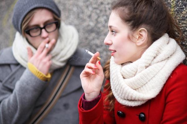 Young couple smoking.