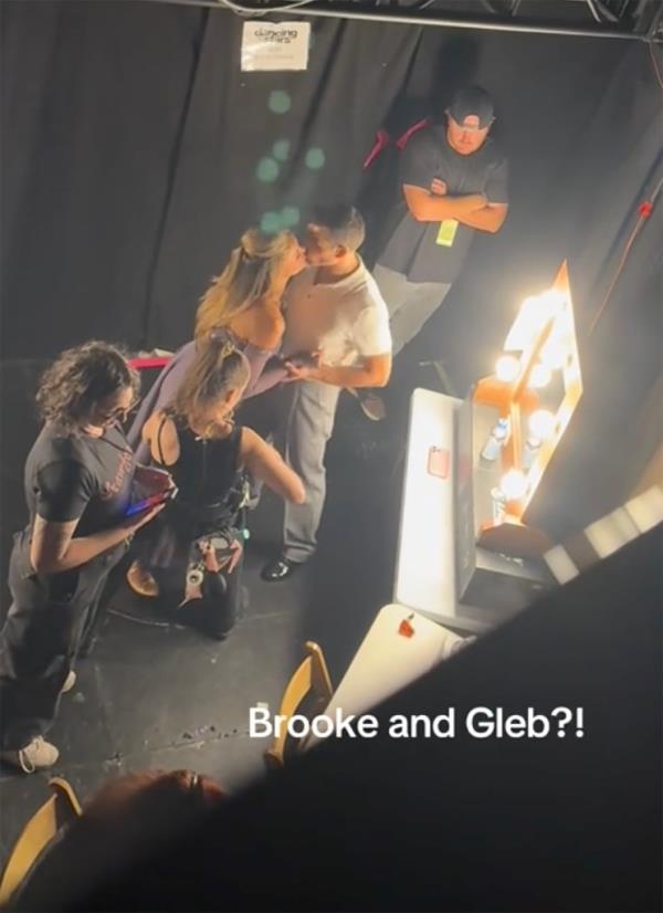 Brooks Nader backstage kissing partner Gleb Savchenko on 