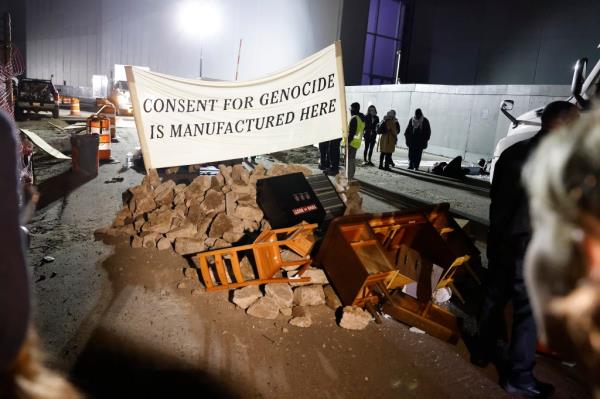 Protesters blocking the entrance to the plant.