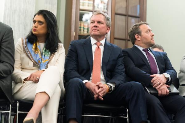 Alan Shaw, the CEO of Norfolk Southern, was fired after the board of directors voted unanimously to terminate him and Nabanita Nag, the chief legal officer. Shaw is seen center while Nag is seen far left.
