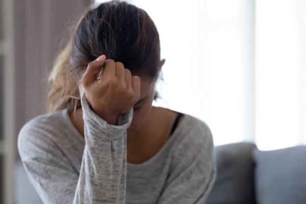 Depressed upset young woman feeling hurt sad stressed troubled with unwanted pregnancy, regret mistake abortion, havin<em></em>g headache or drug addiction, suffer from grief dramatic bad problem concept