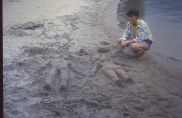 Ilja at a beach in The Netherlands whilst on holiday with her dad - before she was later put into care