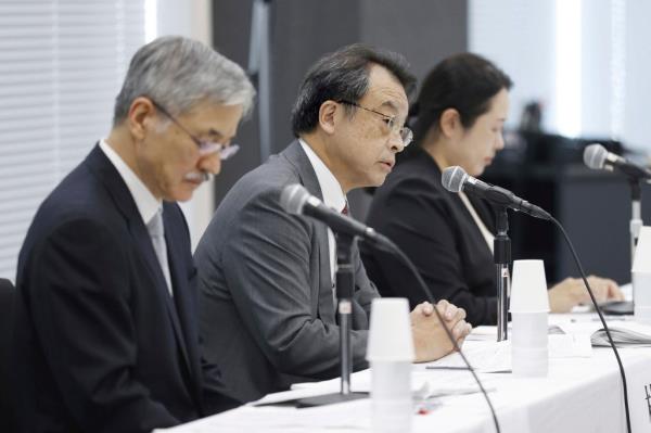 Lawyer and former prosecutor Makoto Hayashi, center, speaks during a news co<em></em>nference in Tokyo Tuesday, Aug. 29, 2023.