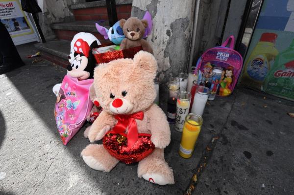 The NYPD stand post outside of the home of 4 year old Jahmeik Modlin