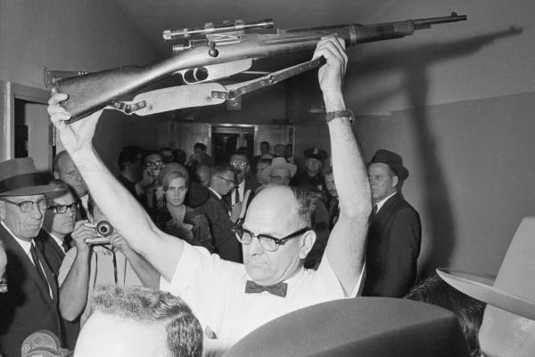 Boyd (R) and his partner Richard Sims (L) escorting Oswald after his arrest in Dallas.