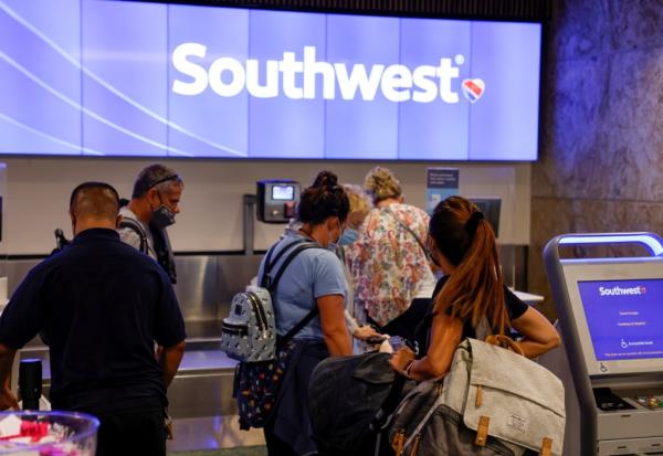 Passengers lining up to check in for a Southwest Airlines flight at Orlando Internatio<em></em>nal Airport, Florida