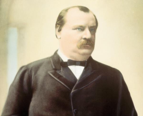 Head-and-shoulders portrait of President Grover Cleveland in a suit, undated hand-colored photograph