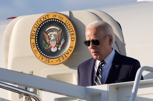 President Biden wearing sunglasses exiting Air Force One.