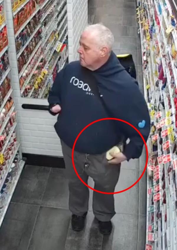 A shoplifter stealing from a supermarket