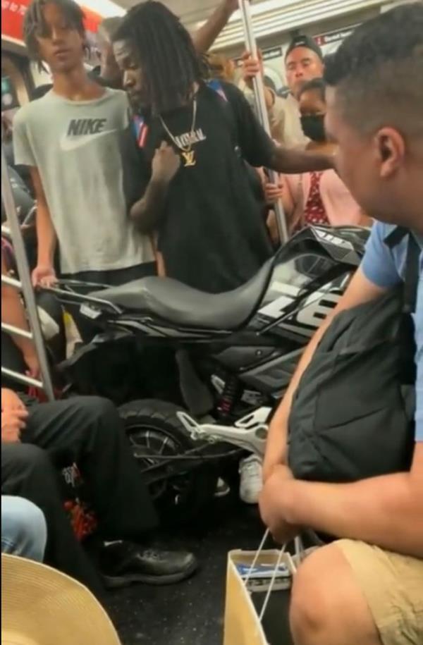 The man was insistent on telling others on the train he wouldn't move to make way for them as his bike took up the community space.