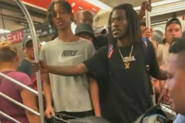 A self centered NYC subway rider was captured on camera getting mad at other commuters while blocking the train car with his massive motorbike.